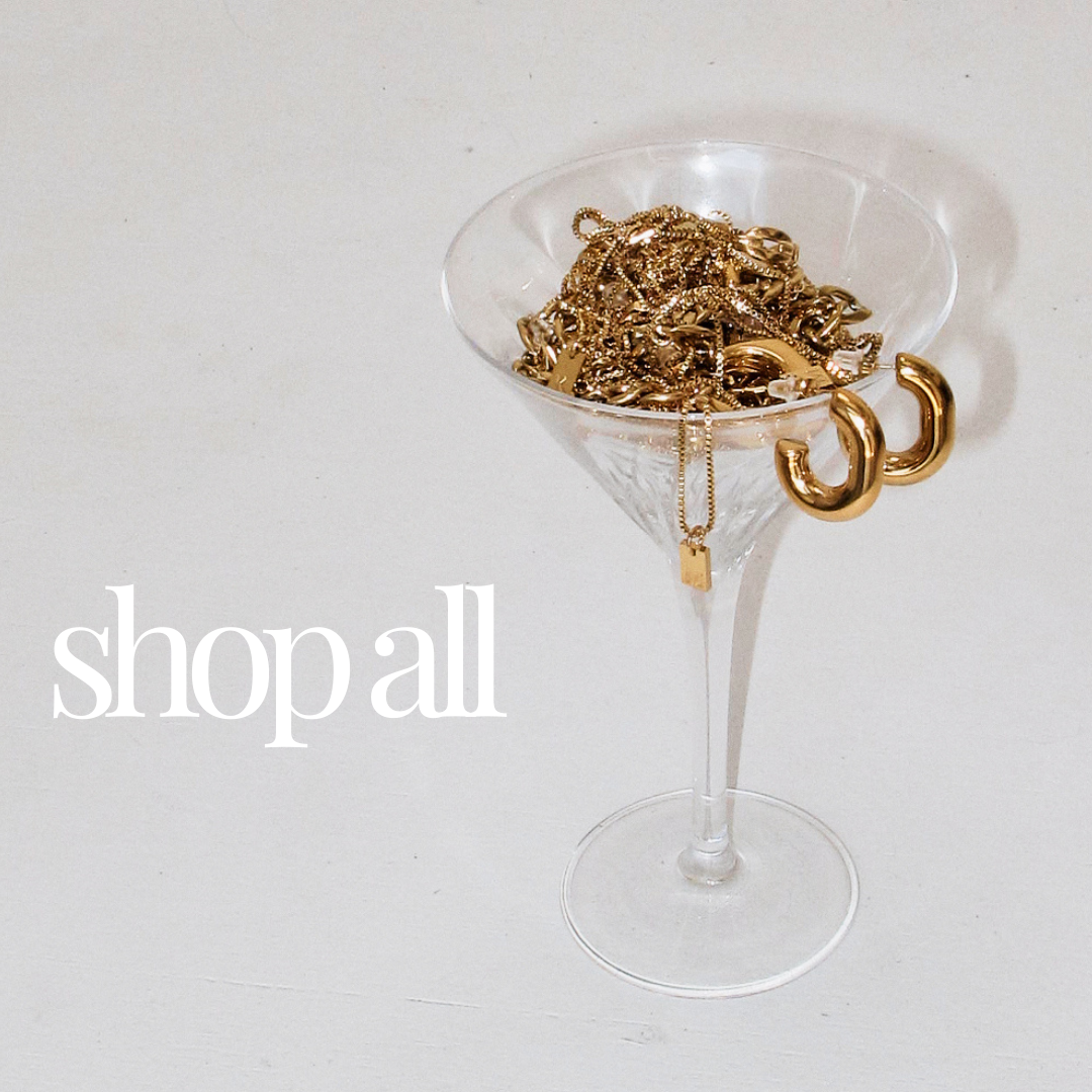 Martini glass full of gold Martini Street Jewellery. Martini Street sell online jewellery pieces which are designed to be waterproof, sweat resistant, and hypoallergenic.
