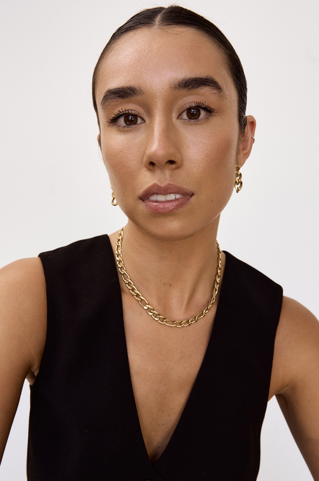 Model posing with a gold chunky bold chain statement necklace from australian online store Martini Street which sells waterproof, high quality jewellery.